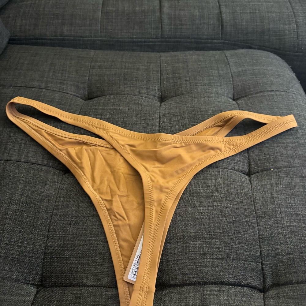 skims swim thong